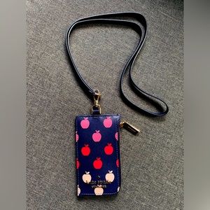Kate Spade Wrist Wallet. Navy leather with pattern. Strap is detachable.